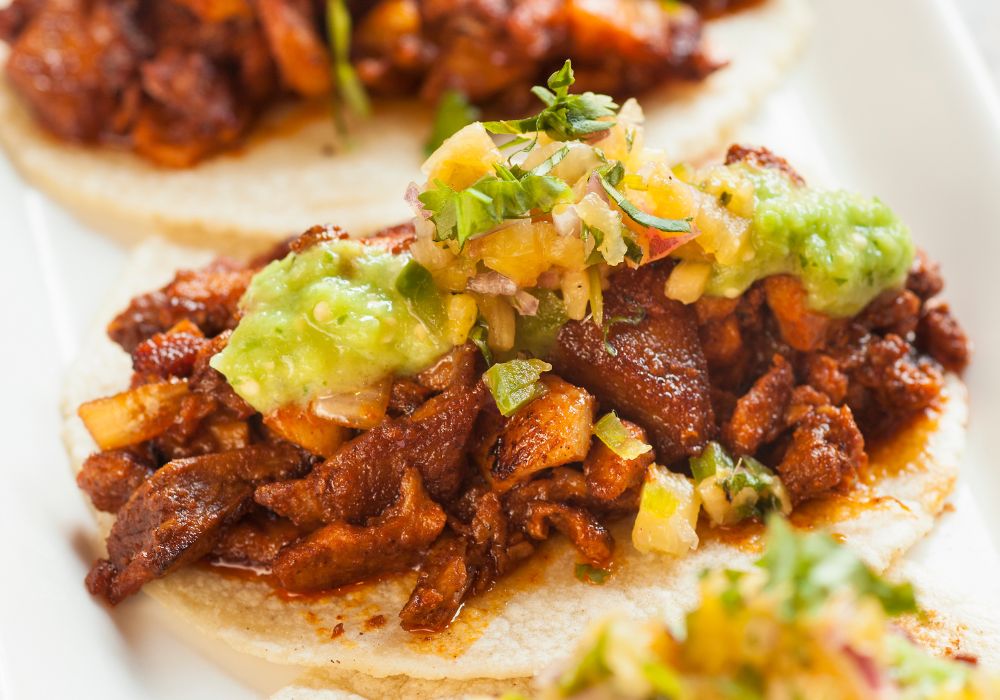  Mexican style tacos al pastor served on soft tortillas.