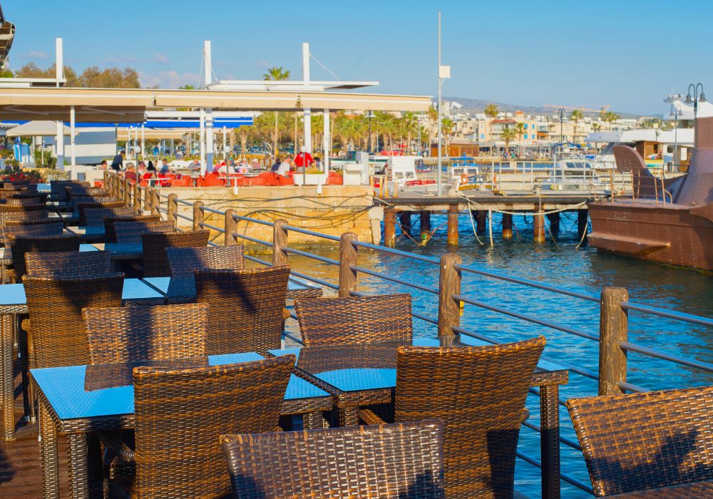 By the sea restaurant in Paphos marina at sunset.