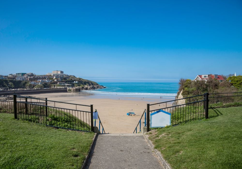 Beautiful blue sky over the golden sands of Towan beach in Newquay, Cornwall.