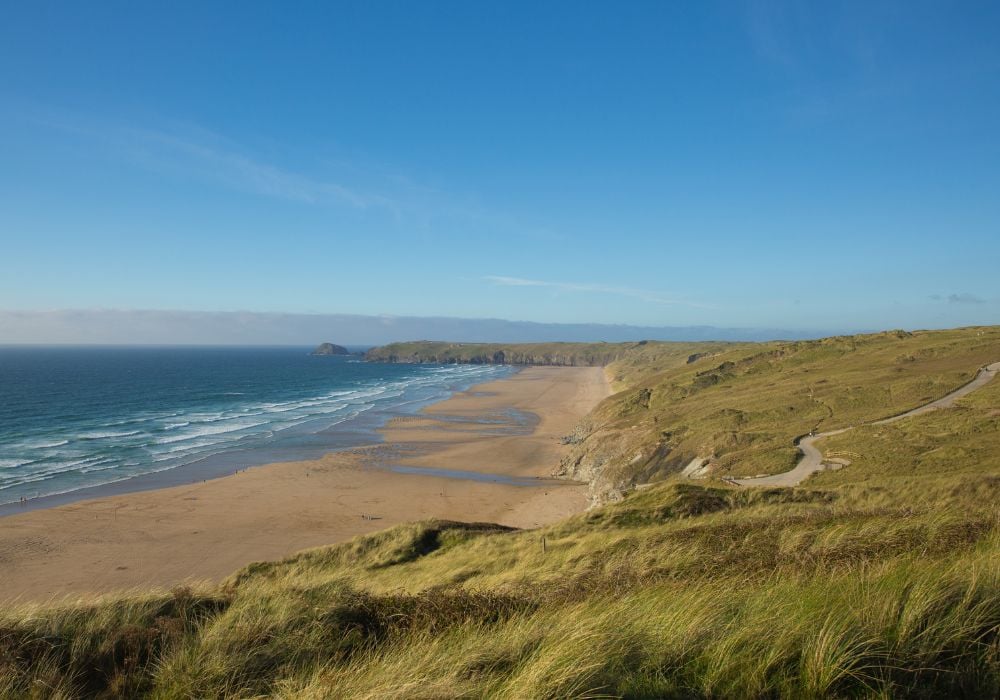 Beautiful blue sky over the stunning Perran Sands beach in Newquay, Cornwall.