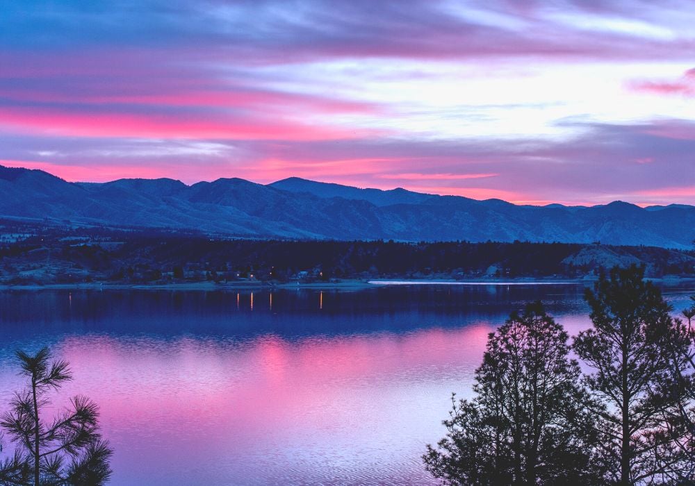 A gorgeous sunrise at Canyon Ferry Lake near Helena in Montana. Stunnjing pinks silhouetting the mountain range.