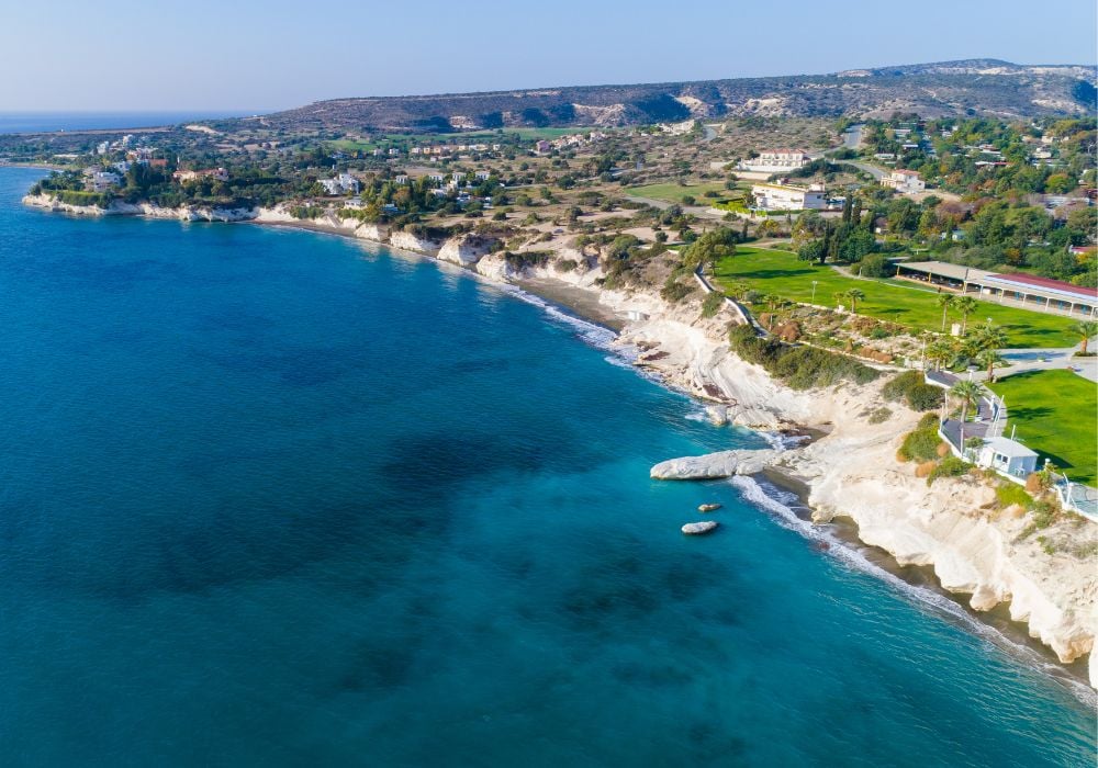 Aerial view of coastline and landmark big white chalk rock at Governor's Beach in Limassol