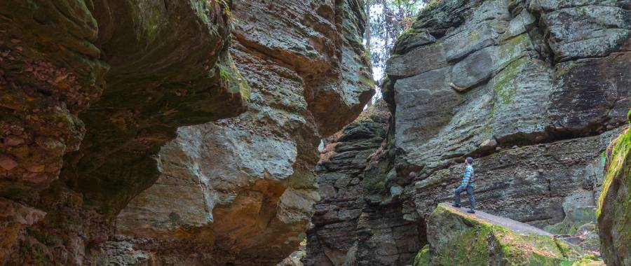 Man standing in an enormous canyon in Wisconsin Dells, WI