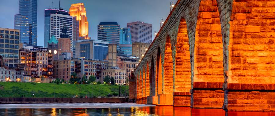 bridge and city view at sunset in Minneapolis, MN