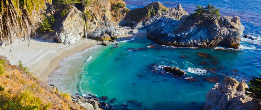 beautiful white sand cove at Big Sur California shot from above