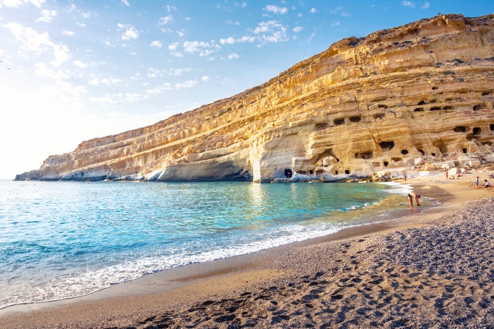 The incredible colors of the cliffs above Matala Beach, Crete, one of the best beaches in Greece for families