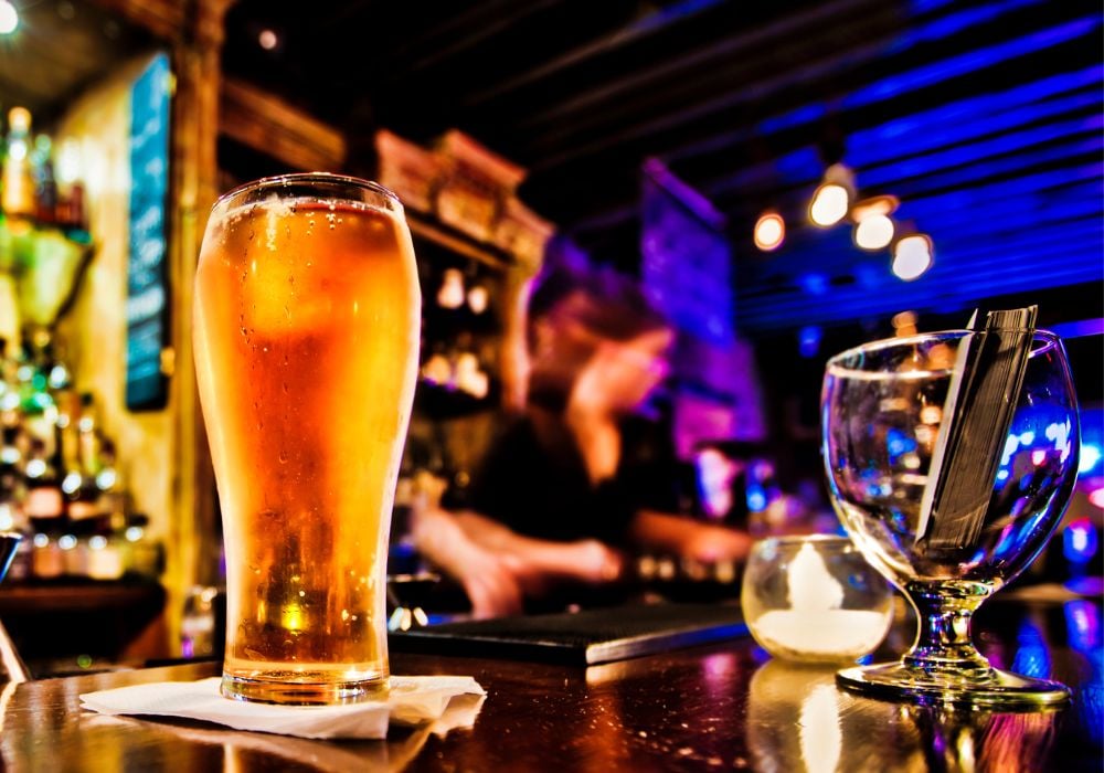 Pint of beer on a bar in a traditional style pub.