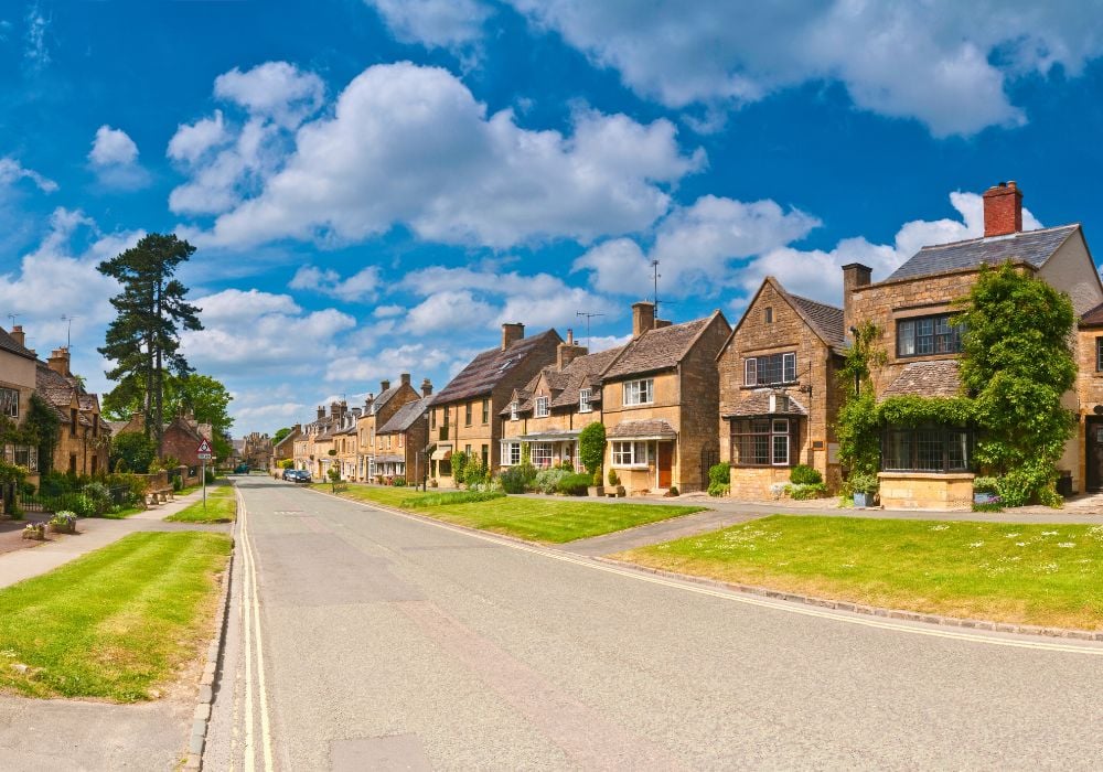 Idyllic village high street tranquil Cotswolds cottages in Broadway, UK.