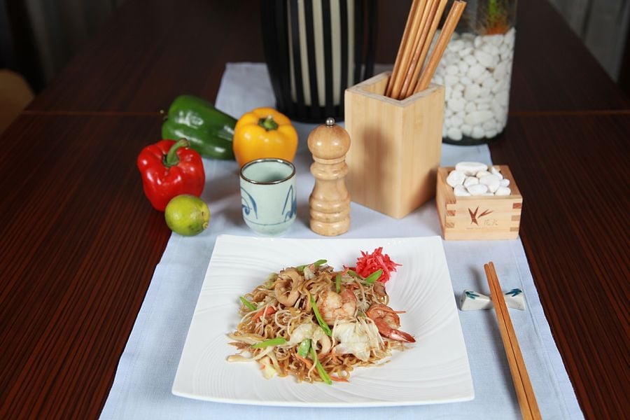 Thai noodles and ingredients on a stylish table