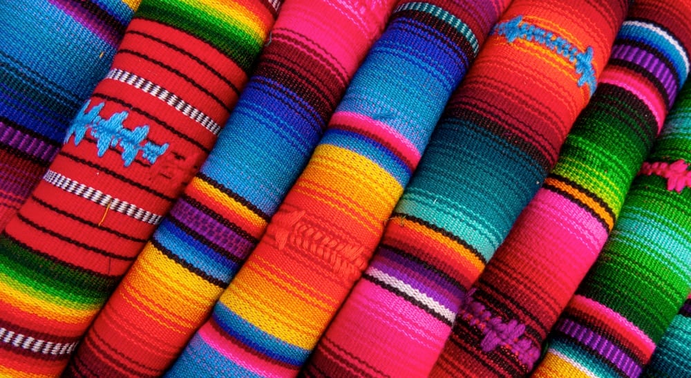 Colorful fabric at a market in La Paz. One of the best things to do in La Paz is to visit a market.