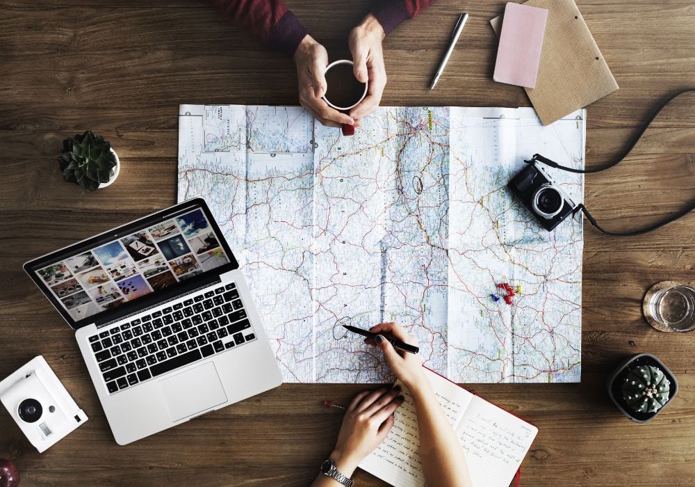 travel accessories for digital nomad on a map
