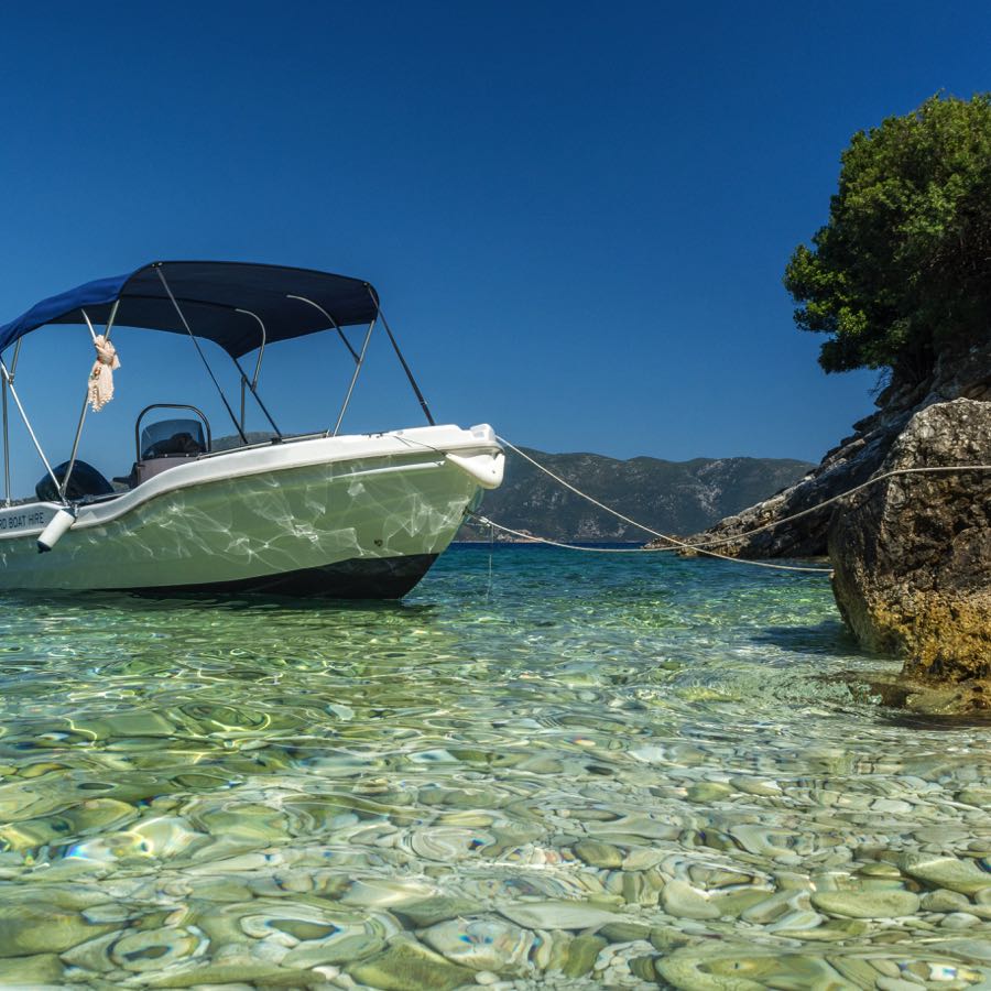Rent a boat in Zakynthos and anchor at a cove