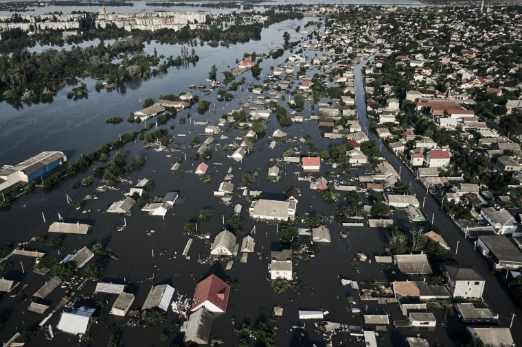 Residents of southern Ukraine, some who spent the night on rooftops, braced for a second day of swelling floodwaters on Wednesday as authorities warned that a Dnieper River dam breach would continue to unleash pent-up waters from a giant reservoir. (AP Photo/Libkos)