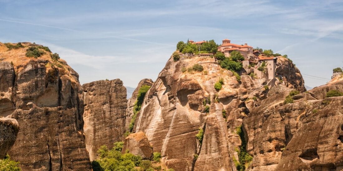 great meteoron monastery sitting on top of a rocky peak in greece