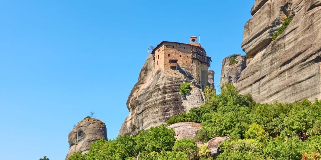 Saint Nikolaos Anapafsas Monastery on top of a rocky cliff in meteora