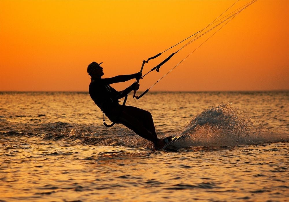 Kitesurfing on the sea at sunset.