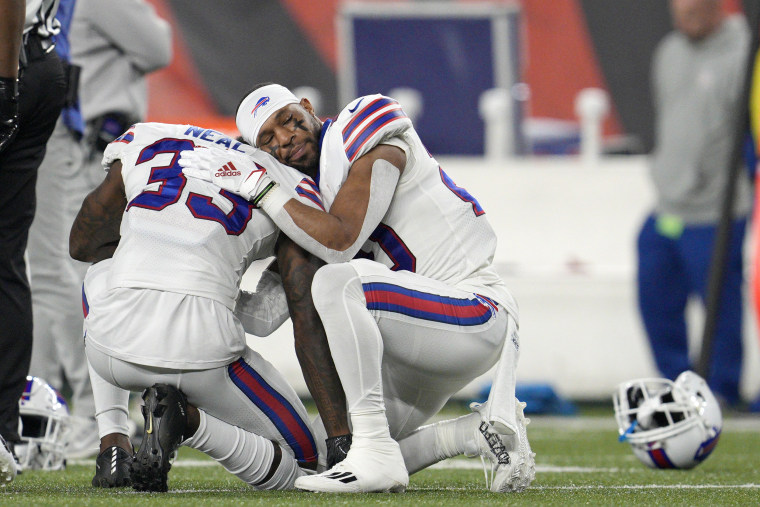 Buffalo Bills' Siran Neal (33) and Nyheim Hines react after teammate Damar Hamlin was injured during the first half of an NFL football game against the Cincinnati Bengals, Monday, Jan. 2, 2023, in Cincinnati.