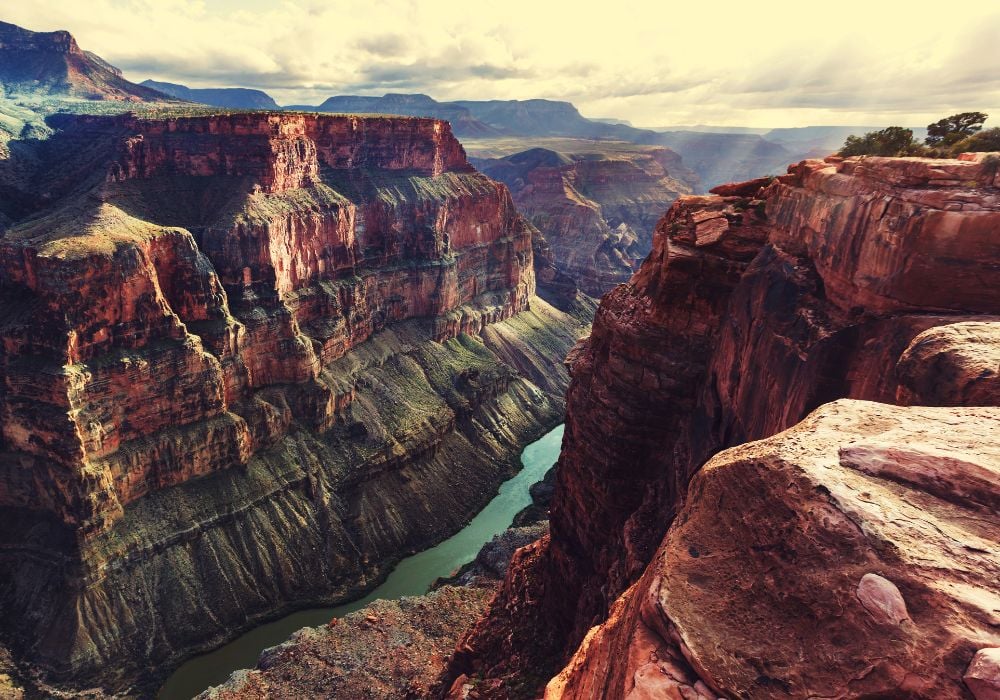 rocks and view of the river at the bottom of the grand canyon