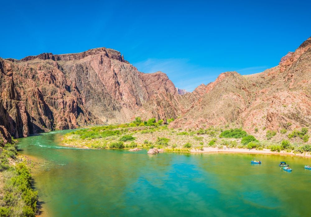 river rafting grand canyon arizona with 4 boats in the water