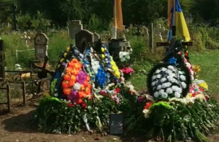 The graves belonging to Svitlana Siemieikina and Kristina Spitsyna, who were killed in the missile attack in Zaporizhzhia on Aug. 9. 