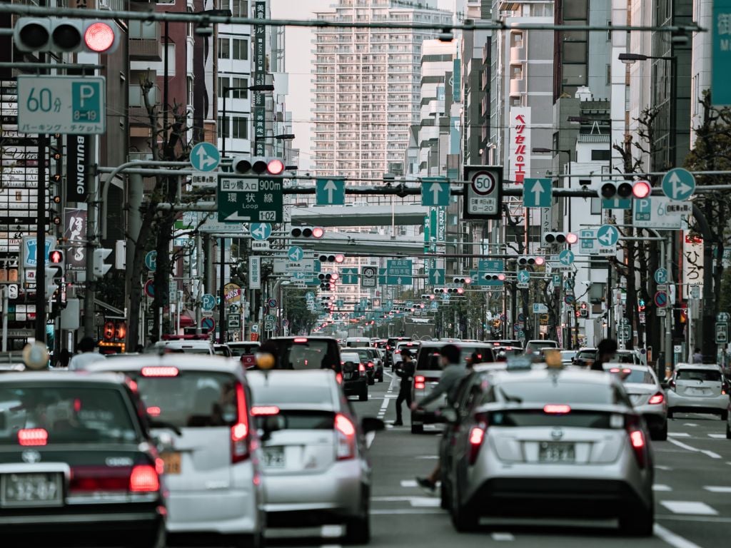 busy streets in osaka with cars