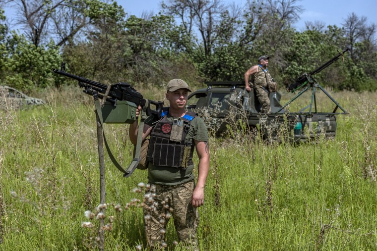 Ukrainian soldiers monitor the sky in search of drones near Bakhmut, Donetsk Oblast, Ukraine