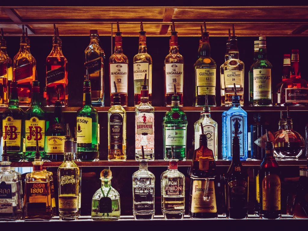 shelf full of hard alcohol at a bar in durham nc