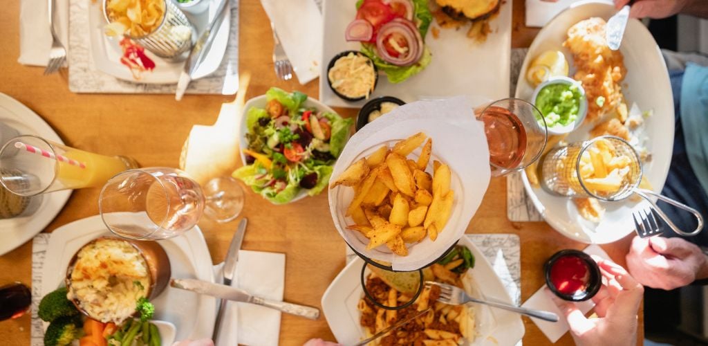 Variety of British food ,salads on a wooden table