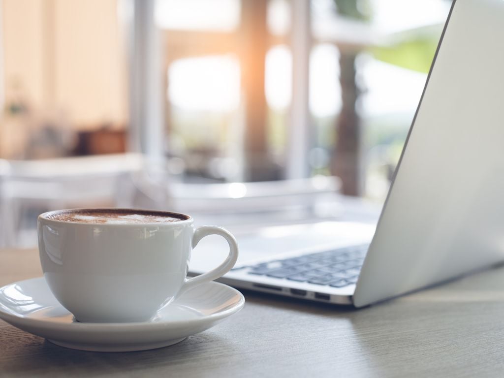 cup of coffee and a laptop