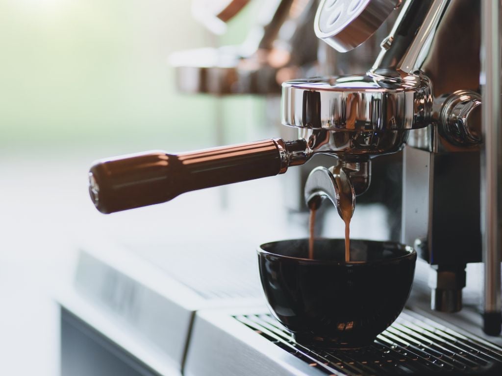 an espresso brewing in a coffee shop