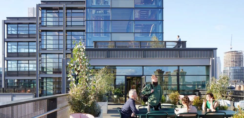 people coworking outside on a patio in london