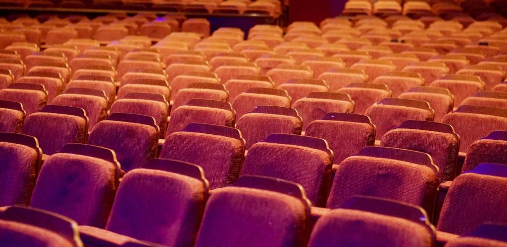 A retro theatre with empty seats 