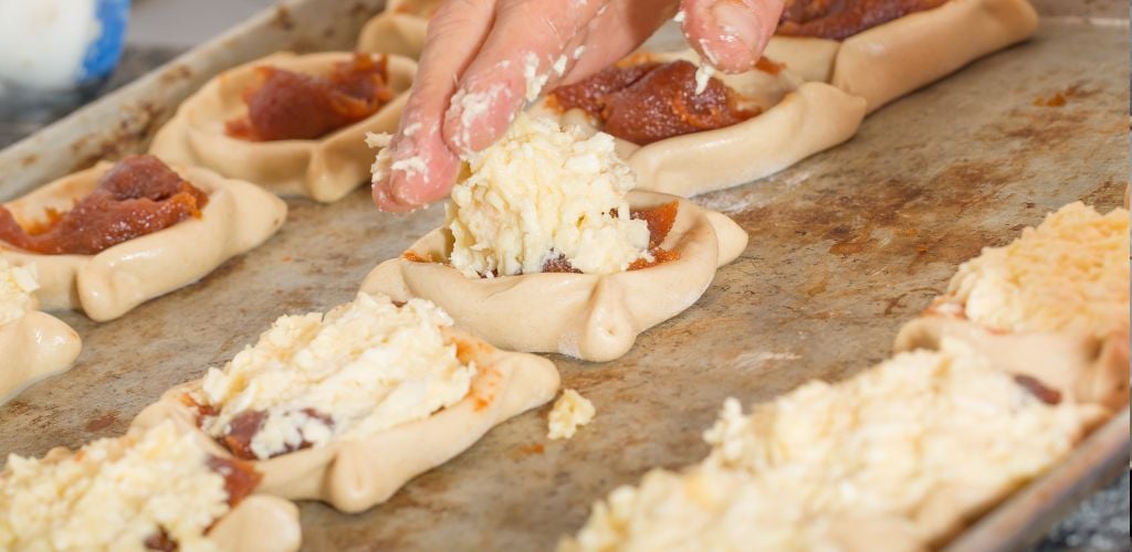 Adding cheese to guava sweet pastry dough for baking