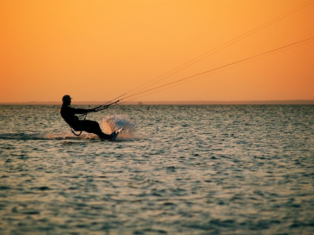 man kitesurfing at sunset in malindi