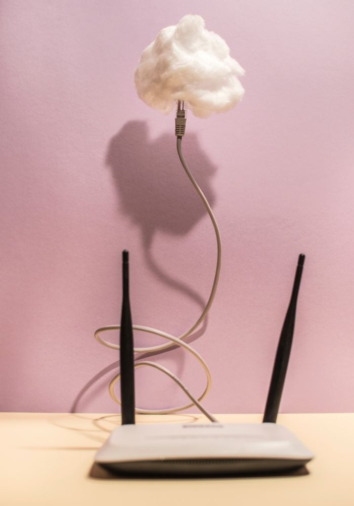 Cloud Concept with WiFi Router on a table