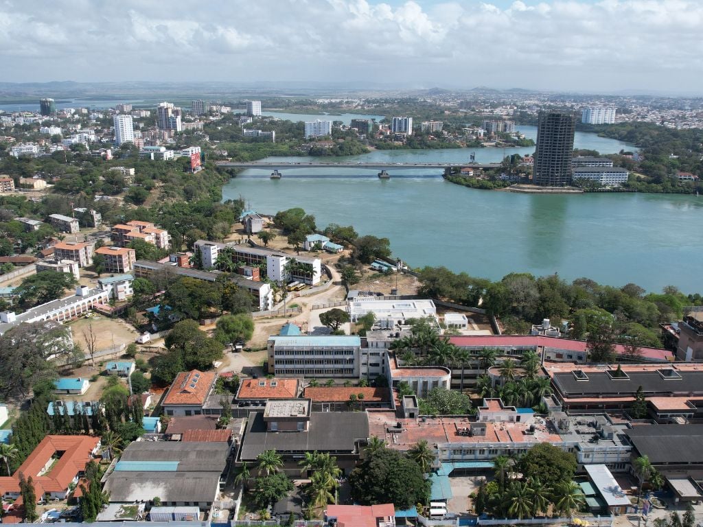 aerial view of mombasa city with the river running through it and the nyali bridge