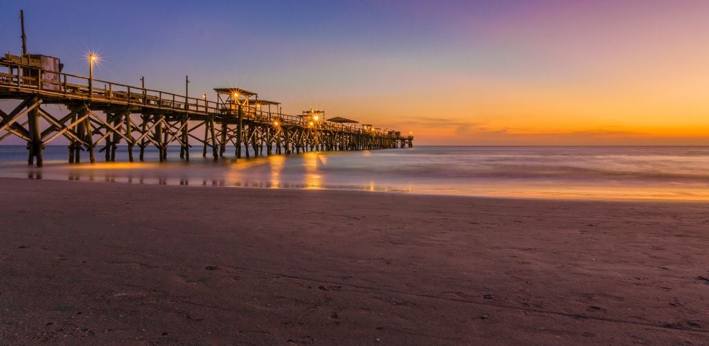 A wooden structure with light in a twilight