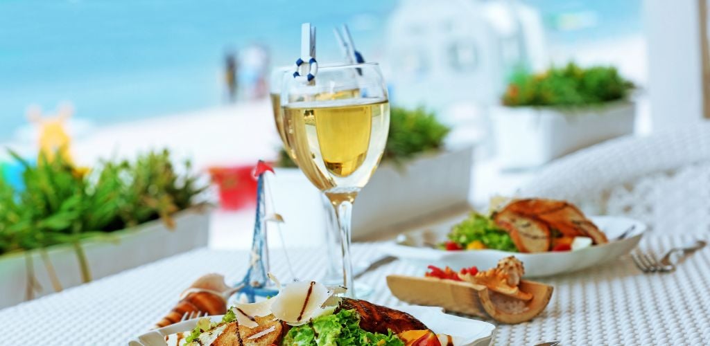 Beach Restaurant with white wine and salad