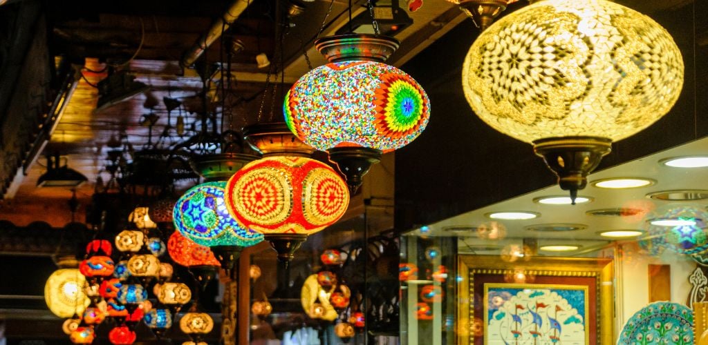 Glass lampshades hanging from the roof of a shop in Fethiye Market, Turkey