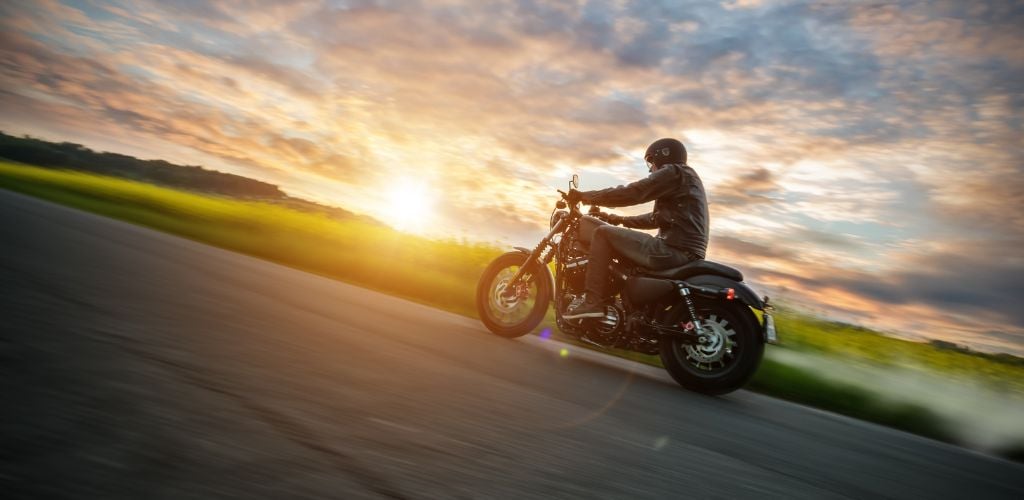 A man riding on a harley-like bikes