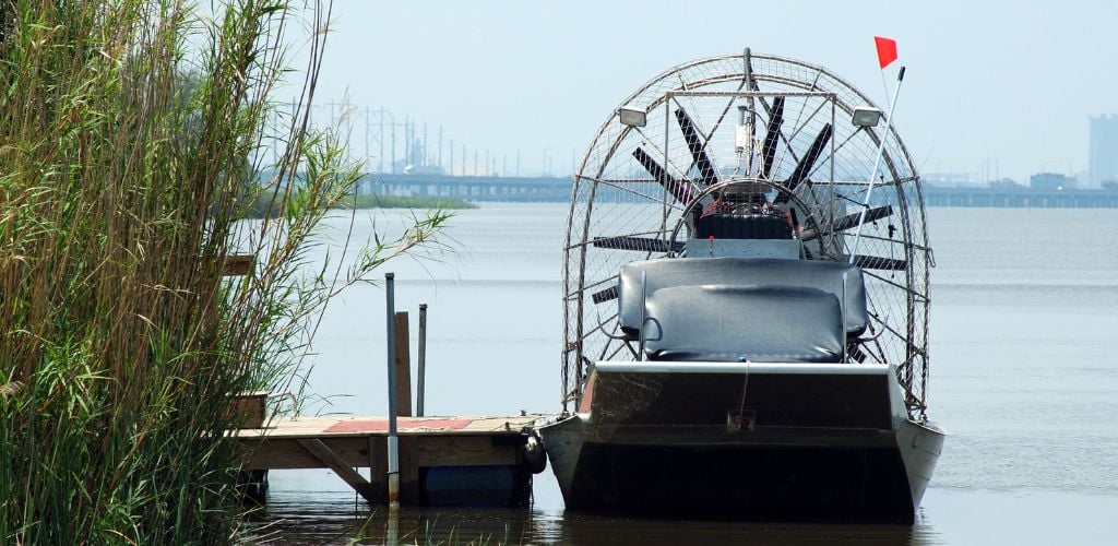 An airboat currently docked. Airboat trips are definitely one of the best things to do in Jacksonville, FL.