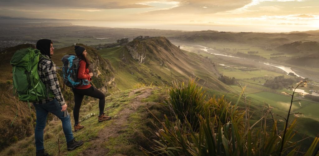 2 Hikers reached the top of the mountain with the best scenery 