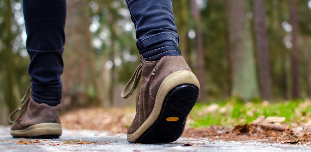 A person walking on a slippery trail 