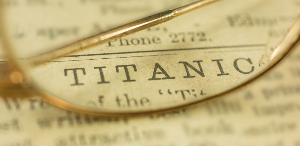 The word TITANIC written on a book zoomed by an eyeglass