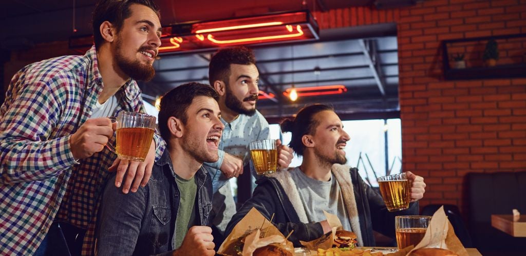 Group of friends in a Pub Watching some sports action