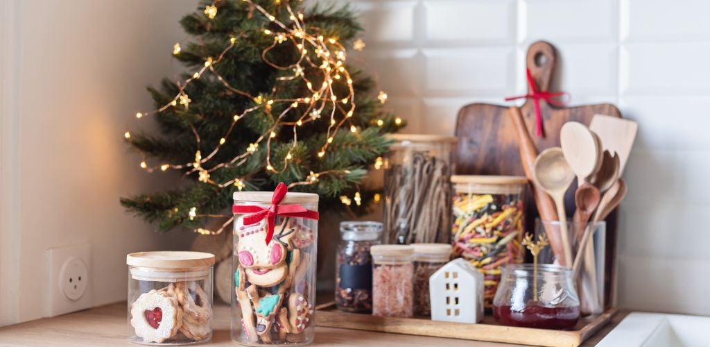 Gingerbread Cookies and a christmas tree behind it