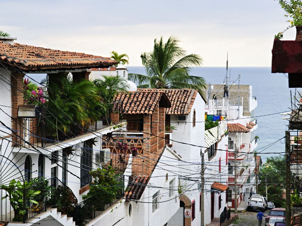 white homes, power lines and shingled roofs in puerto vallarta