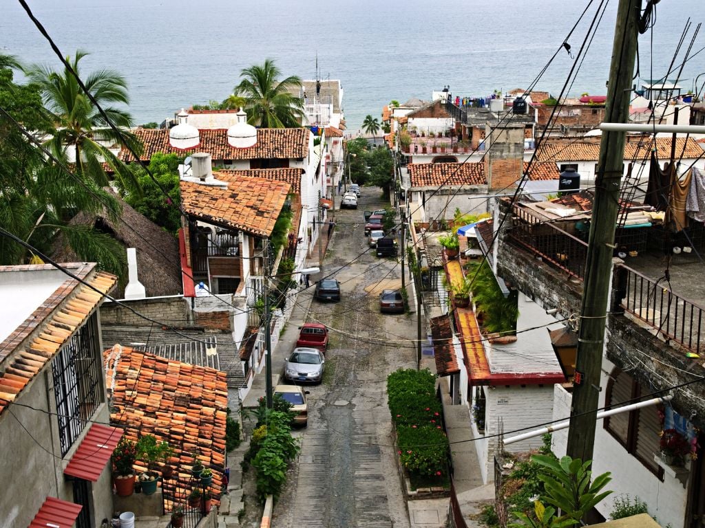 street leading down to the ocean with local homes i puerto vallarta