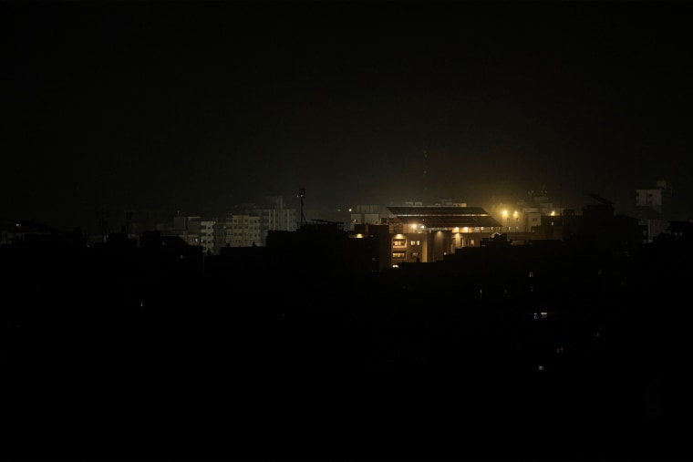 Following a loss of power in Gaza, a building is illuminated by solar energy on Oct. 12, 2023.