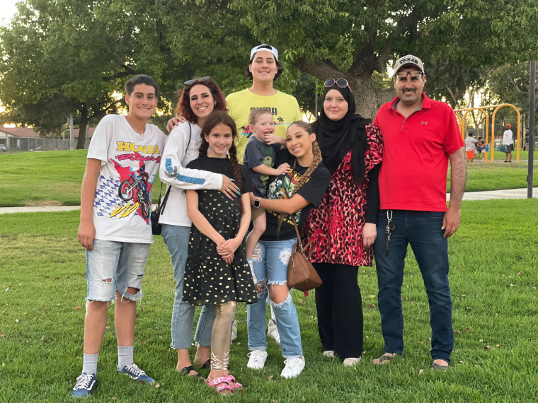 Esam Kaoud with his wife, some of his children, and grandson.